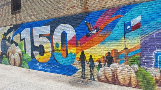 Local artists restores Taylor city mural after vandalism