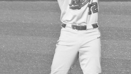 Taylor senior shortstop Dominick Hartman flexes his muscles after hitting a double vs. Salado in the top of the third inning. See story on this page. Photo by Andrew Salmi