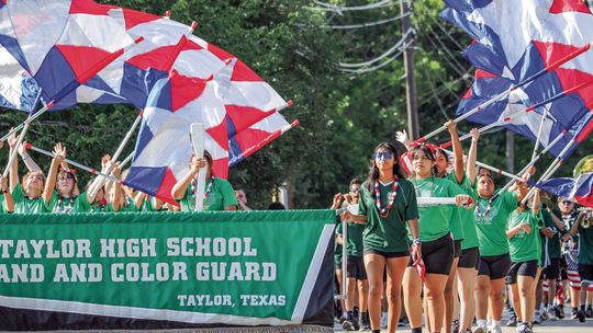 Members of the Taylor High School band and color guard marched and performed during the Fourth of July parade Thursday morning