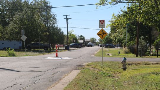 The mini traffic calming circles should be treated more as an obstacle than a roundabout. Drivers should slow down and proceed in the same way they would if it were a large box in the road. Photo by Edie Zuvanich