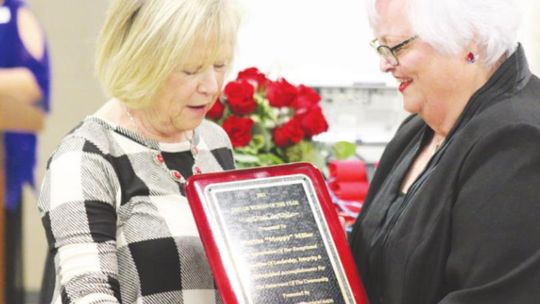 TOP: Moppy Miller (left) accepts the Taylor Area Businesswomen (TAB) Woman of the Year award from TAB president Charlotte Albert.