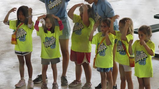 Estanna de Senna, Willow Fox, Gigi Bond, Olivia Gamboa, Sofia Outlaw and Olivia Arnold perform a skit this past Friday, June 17 as counselors Stella Fitzpatrick and Greta Hutmacher help coordinate.