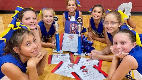 St. Mary’s Catholic School cheerleaders celebrate awards from the National Cheerleaders Association summer day cheer camp in July. Courtesy photos