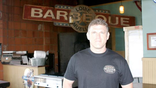 Third-generation owner Wayne Mueller stands inside Louie Mueller Barbecue in this 2013 photo. File photo