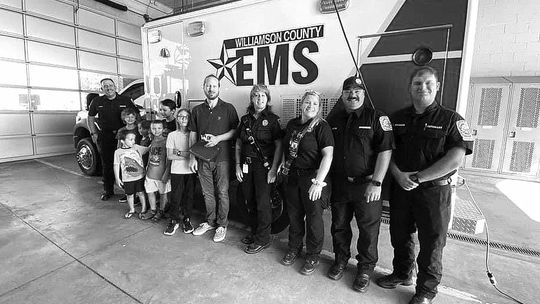 Members of Williamson County EMS thanked and recognized the children of Micheal Gates after they helped save their father’s life. Courtesy photos