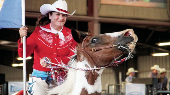 Horse rider carries a military flag during Thursday’s “Heroes Night” at the 2023 Taylor Annual Rodeo at the Williamson County Expo Center. Photos by Hunter Dworaczyk