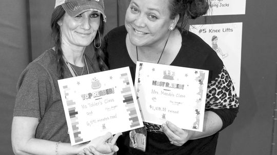 Naomi Pasemann Elementary School recently held a Read-A-Thon to raise money for the school and to celebrate reading. Pasemann teachers Jennifer Tobler and Holly Mando accept certificates on behalf of their students for the most minutes read (Tobler; 6,591) and most money raised (Mando; 1,4...