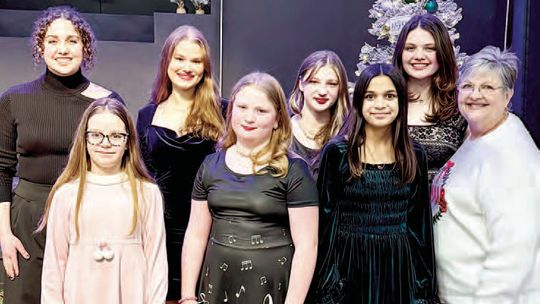 Piano students ring in Christmas with music