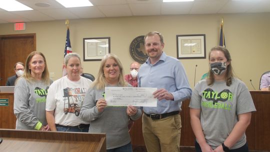 Members of the Taylor Pickleball group present a check to Taylor municipal government through Tyler Bybee, Taylor Parks and Recreation director, during the Jan. 13 City Council meeting. Pictured are (from left) Cathy Warner, Sheila Pausewang, Brenda Cox, Bybee and Lynsie Patschke. Photos b...