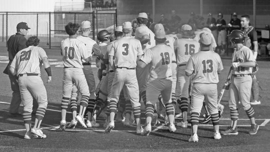 Taylor High School varsity baseball senior outfielder Conner Barcuch is swarmed by his teammates after hitting a solo home run on May 18 during the Ducks’ 5-0 win over Salado High School in game 1 of the 4A regional quarterfinals held at Georgetown East View High School. Photos by Andrew S...