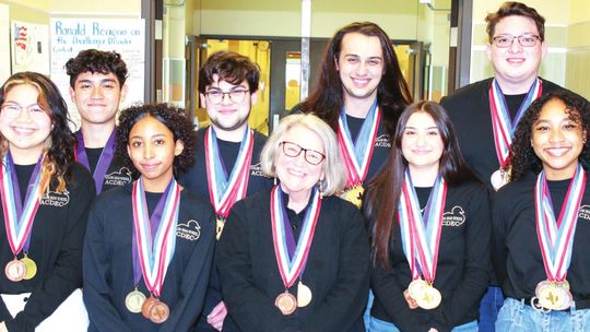 Taylor High School Academic Decathlon team celebrate their recent bronze finish at the Texas State Academic Decathlon Competition at the University of Incarnate Word in San Antonio Feb. 25-26. The team includes, from left, Soryna McIntire, Yahir Cancel, Lluvia Allen-Correa, Zane Talavera,...