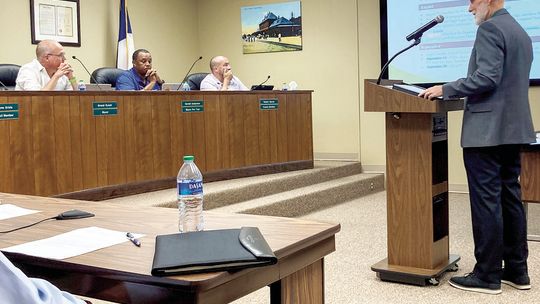 Taylor’s Chief Financial Officer Jeffrey Wood gives a preliminary presentation of next year’s budget to the City Council at the July 13 meeting. Photo by Nicole Lessin