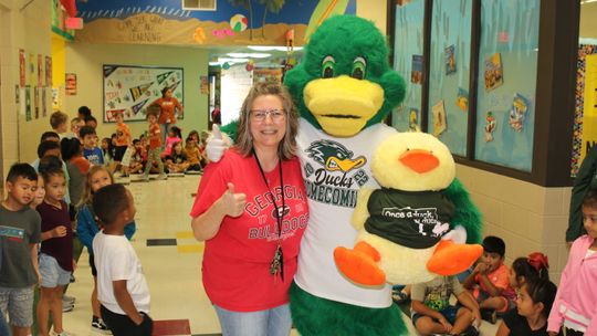 T. H. Johnson’s library mascot, Quackers, recently met his hero, Taylor High School mascot, Waddles. The meeting was arranged by THJ librarian, Brenda McNulty. Courtesy photo by Tim Crow