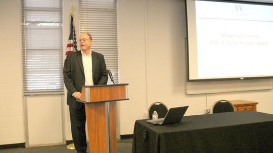 Senior Director of Infrastructure for Williamson County Bob Daigh speaks at the monthly luncheon for the Greater Taylor Chamber of Commerce Sept. 19 at the Taylor Independent School District Event Center. Photo by Nicole Lessin