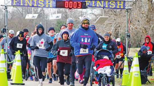 Runners take off into the chilly Saturday morning wind at the 2022 Taylor Garden Club Run for the Roses 5K/10K. Photos by Matt Hooks