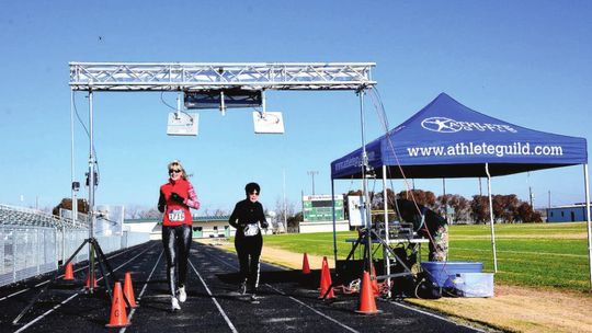 Coral and Donna Noonan cross the finish line together at the Run for the Roses 5K in Taylor Jan. 23, 2016. File photo