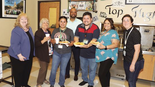 Michele Glaze, Director, Corporate Affairs, Samsung (far left), and Wesley King, Community Affairs Specialist, Samsung (far right), visit with Taylor High School staff during an appreciation luncheon sponsored by Samsung. From left are Michele Glaze, Suzanne Morris, Vanessa Villarreal, Mat...