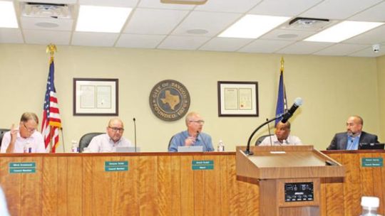 The Taylor City Council vote on one of several items related to a planned Samsung Austin Semiconductor plant during a meeting at City Hall in Taylor July 14. Photo by Fernando Castro