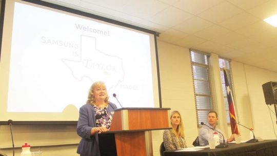 Samsun Austin Semiconductor’s Michele Glaze (left), Dana Harris and Matt Menotti talk at the Greater Taylor Chamber of Commerce luncheon March 21 in Taylor. Photo by Fernando Castro