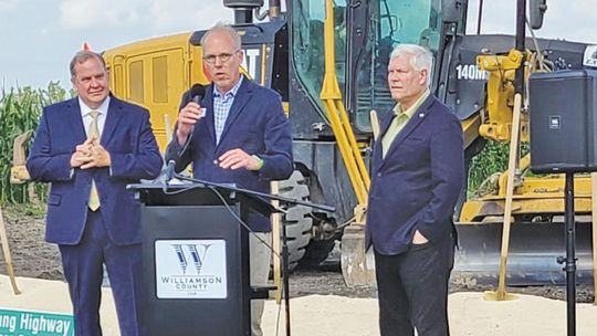 Mayor Brandt Rydell addresses the crowd with Williamson County Precinct 4 Commissioner Russ Boles and US Congressman Pete Sessions. Photo by Edie Zuvanich