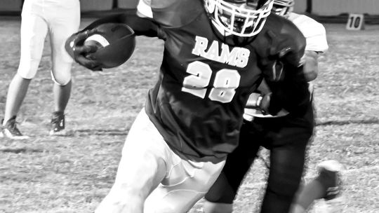 Rams’ senior Ryan Altman evades a defender to gain extra yards. Courtesy photo