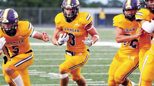 Lions’ senior DJ McClelland runs through a big hole to pick up extra yards. Photo by Larry Pelchat