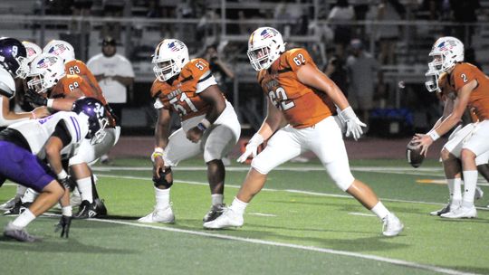 Hutto High School varsity football senior offensive guard Jamarion Whitley (51) and senior offensive tackle Preston Huneycutt (62) drop back into pass protection on Aug. 25 during the Hippos’ home game vs. San Marcos High School. Photo by Larry Pelchat 