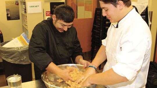 Culinary arts students prepare the masa for making tamales. photos by Photos by Tim Crow