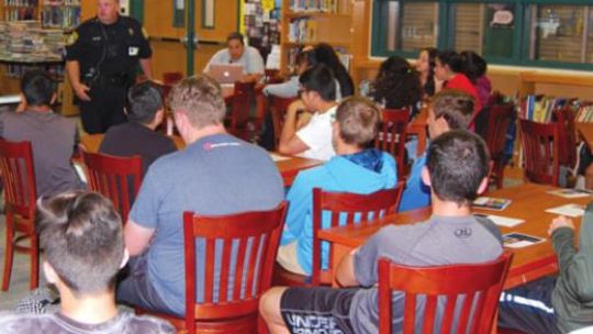 Students at Taylor Middle School attend an anti-bullying presentation by Williamson County Precinct 4 Constable Paul Leal and his office in this 2019 photo. Photo by Matt Hooks