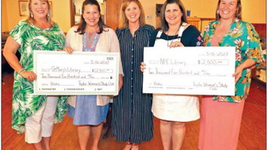 Ann Hughes of the Taylor Woman’s Study Club presents two checks for $2,500 each to Pasemann Elementary School and St. Mary’s School to purchase books for their libraries. Accepting on behalf of Pasemann are Librarian Julie Snyder and Principal Cynthia Proctor. Accepting for St. Mary’s are...