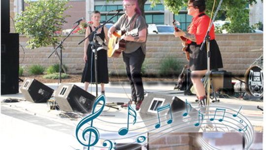 (From left) Kelly McRae, Brooke Ashley Eden and Mandy Marie Luke perform at Heritage Square Thursday night. Photo by Nicole Lessin