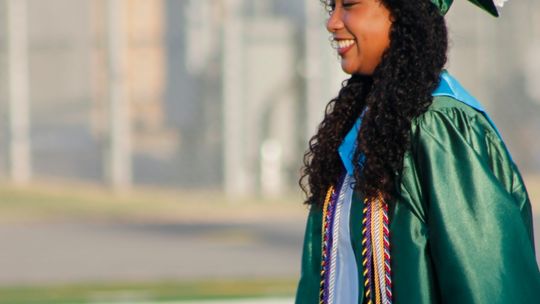 Samantha McIntyre walks at the field at Taylor Stadium in Taylor during high school commencement ceremonies May 27. Photo by Matt Hooks