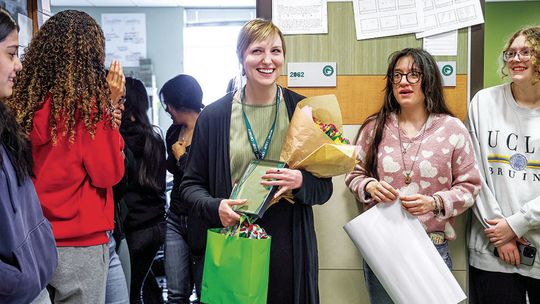 Taylor High School’s Teacher of the Year, Amber Nunnery, is congratulated by her students. Photo by Ryan Newsom