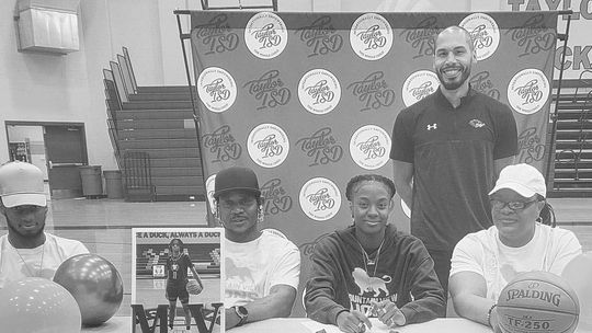 Taylor athletes sign dotted line