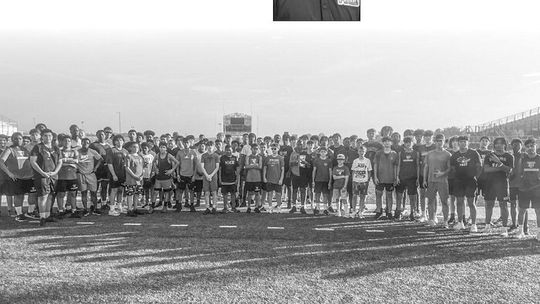 Taylor boys athletes in high school and middle school pose for a photo on Tuesday, June 6 following the first day of strength and conditioning held at Taylor Stadium.