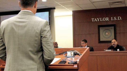 James Guerra, president and CEO of JG Consulting, presents the firm’s recommended hiring timeline to Taylor Independent School District’s board of trustees. Photo by Hunter Dworaczyk