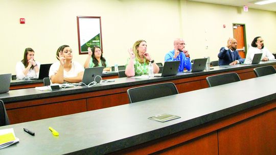 Taylor Independent School District principals listen to a presentation from Superintendent Devin Padavil Sept. 19 at the regular meeting of the board of trustees. Photo by Nicole Lessin