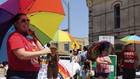 At last year’s Pride festival, Sheyenne Alverez enjoys the music while also serving as a member of the Parasol Patrol. Photo by Jason Hennington