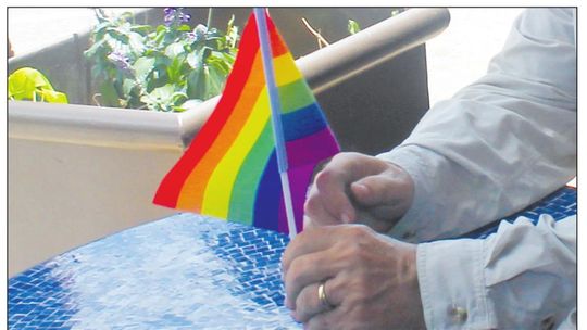 A resident holds a flag at the Taylor PRIDE event June 26, 2021. Photo by Fernando Castro