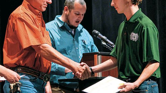 Trevor Wuensche accepts the Denisse Wuensche Scholarship in the amount of $1,000. Photos by Ryan Newsom