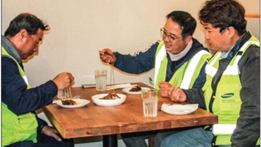 (From left) Kee Jun Jeong, from LS Electric, enjoys lunch with Kyung Joe and Min Suk Cho March 2. Photos by Nicole Lessin