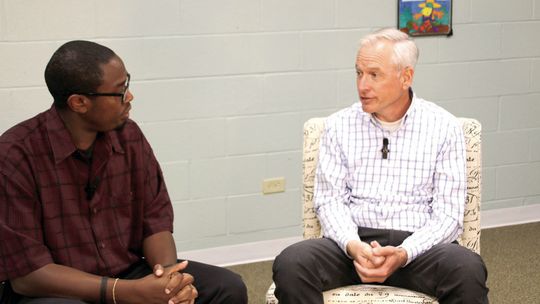 (From left) Area Editor Jason Hennington discusses new developments coming to the city with Assistant City Manager Tom Yantis May 8 at the Taylor Press’ studio. Photo by Nicole Lessin