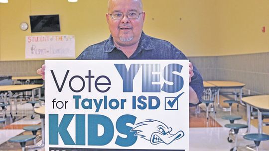 Citizens for Taylor ISD Political Action Committee member Thomas Martinez encourages other attendees to vote in favor of the school bond at a recent public meeting. Photo by Edie Zuvanich