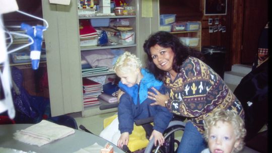 Bernice Sanchez assists students at Northside Elementary School during the early days of her career around 1996. Photo by Tim Crow