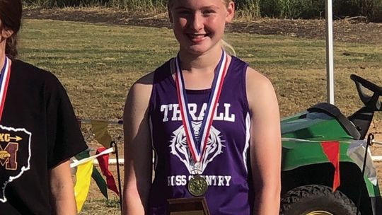 Thrall sophomore Sarah Beth Laurence poses with her awards after District 27 Championship meet Monday. Courtesy Photo Thrall ISD