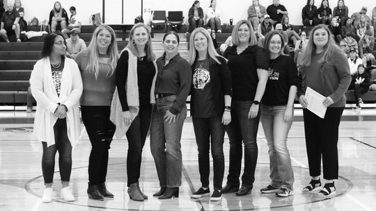 The 1992-93 Thrall Tigerettes pose for a picture together after the recognition cerenony. From left to right: Tracy Coulter Irvin, Erica Hernandez Gardner, Monica Schroeder Bowman, Donna Hejl Baldwin, Jenny Bartz Leschber, Nikki Reiger Leschber, Melissa Hines Crabb, Lauren LoLo Roberson. P...