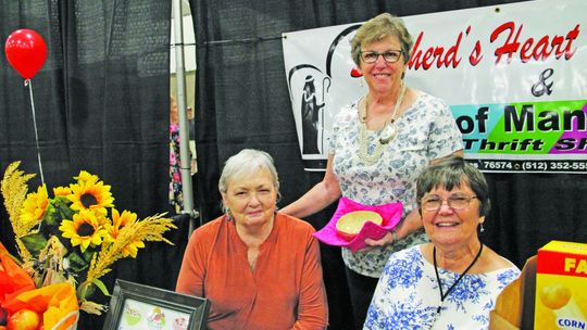 Shepherd’s Heart Taylor food pantry Executive Director Loretta Masters with Cheryl Cornelius, and Linda Flens at the Business Expo &amp; Job Fair Sept. 10. Photo by Nicole Lessin