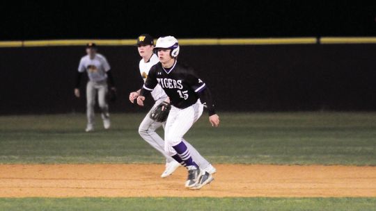 Maverick McAllister taking a lead off of second base looking to steal third.