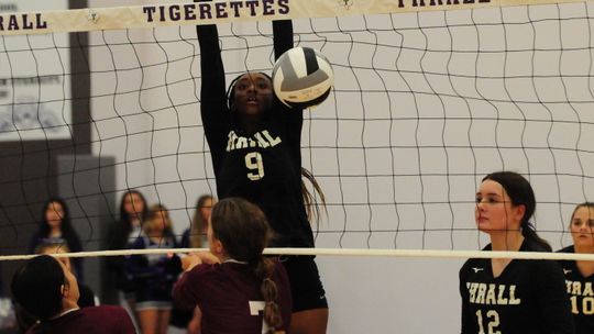 Tigerettes varsity volleyball sophomore Nevaeh Irvin blocks a shot at the net on Aug.22 during the Thrall match win against Troy.