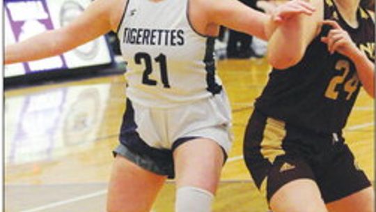 Tigerettes senior Miranda Richter battling and fighting through contact to grab a rebound. Photo by Larry Pelchat